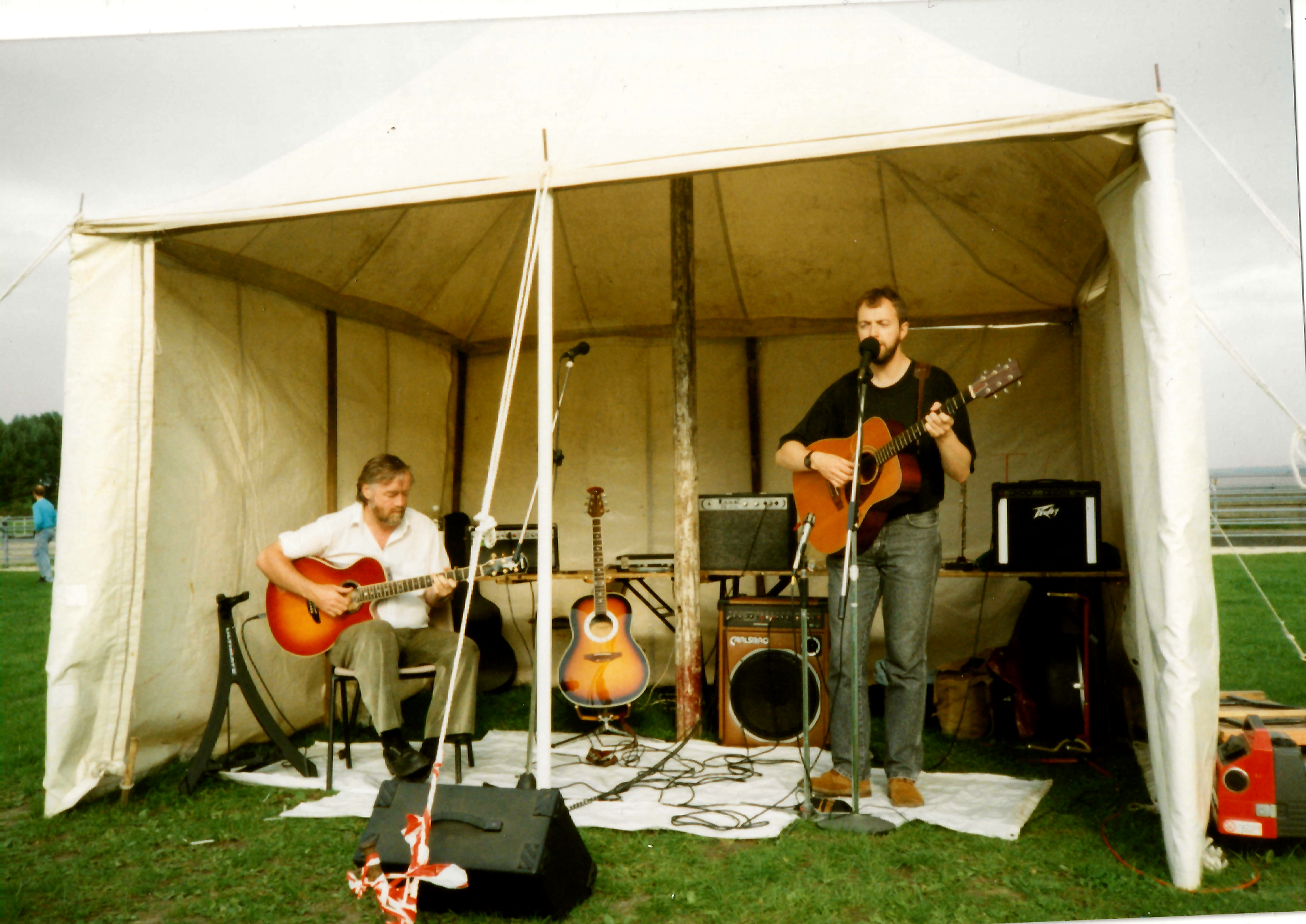Steve McWilliam and Ian Jesse performing together on acoustic guitars at Spike Island in 1995