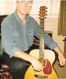Kieran Fish with homemade guitar